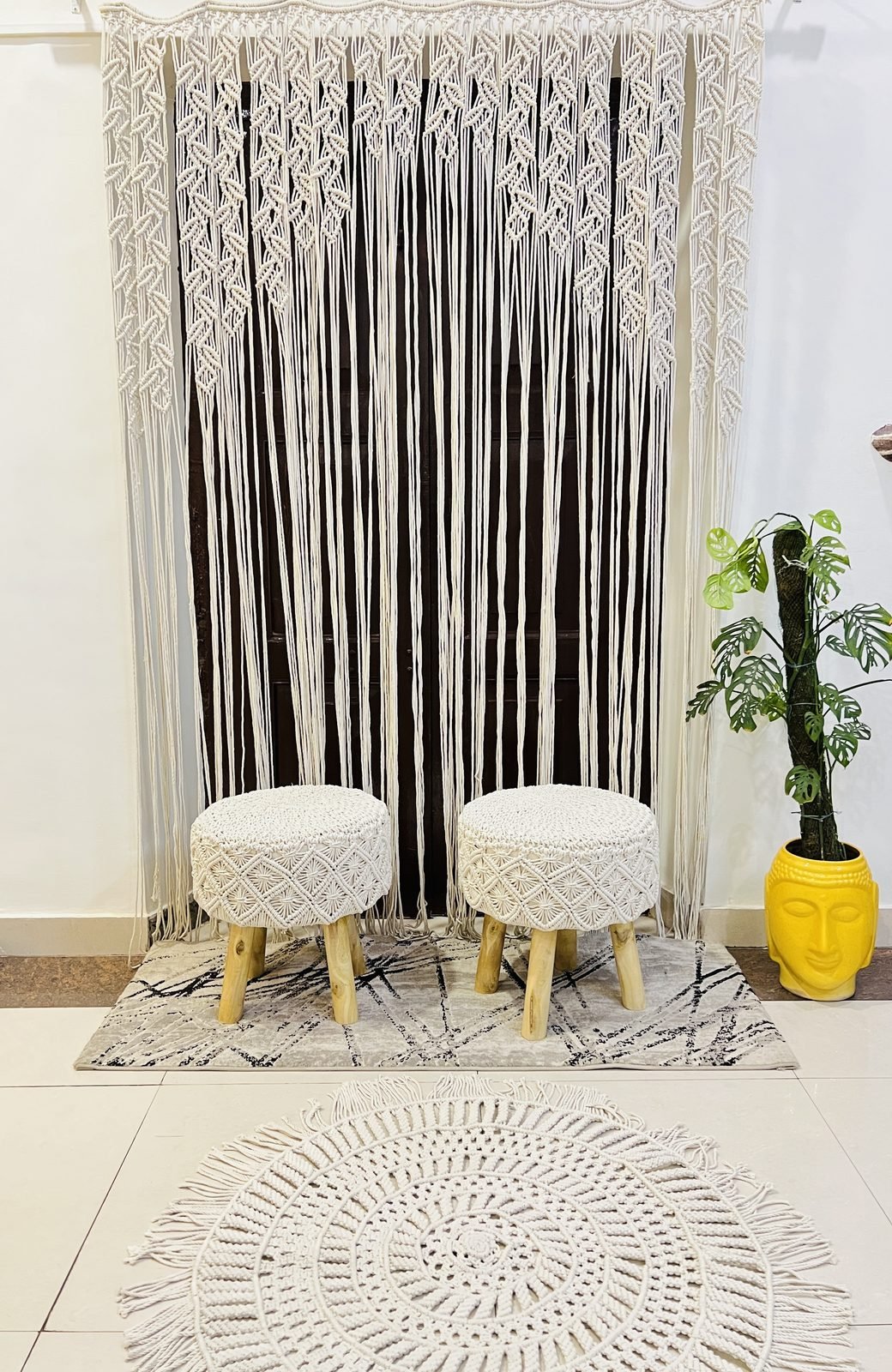 Macramé door curtain with off-white macramé stools styled at home