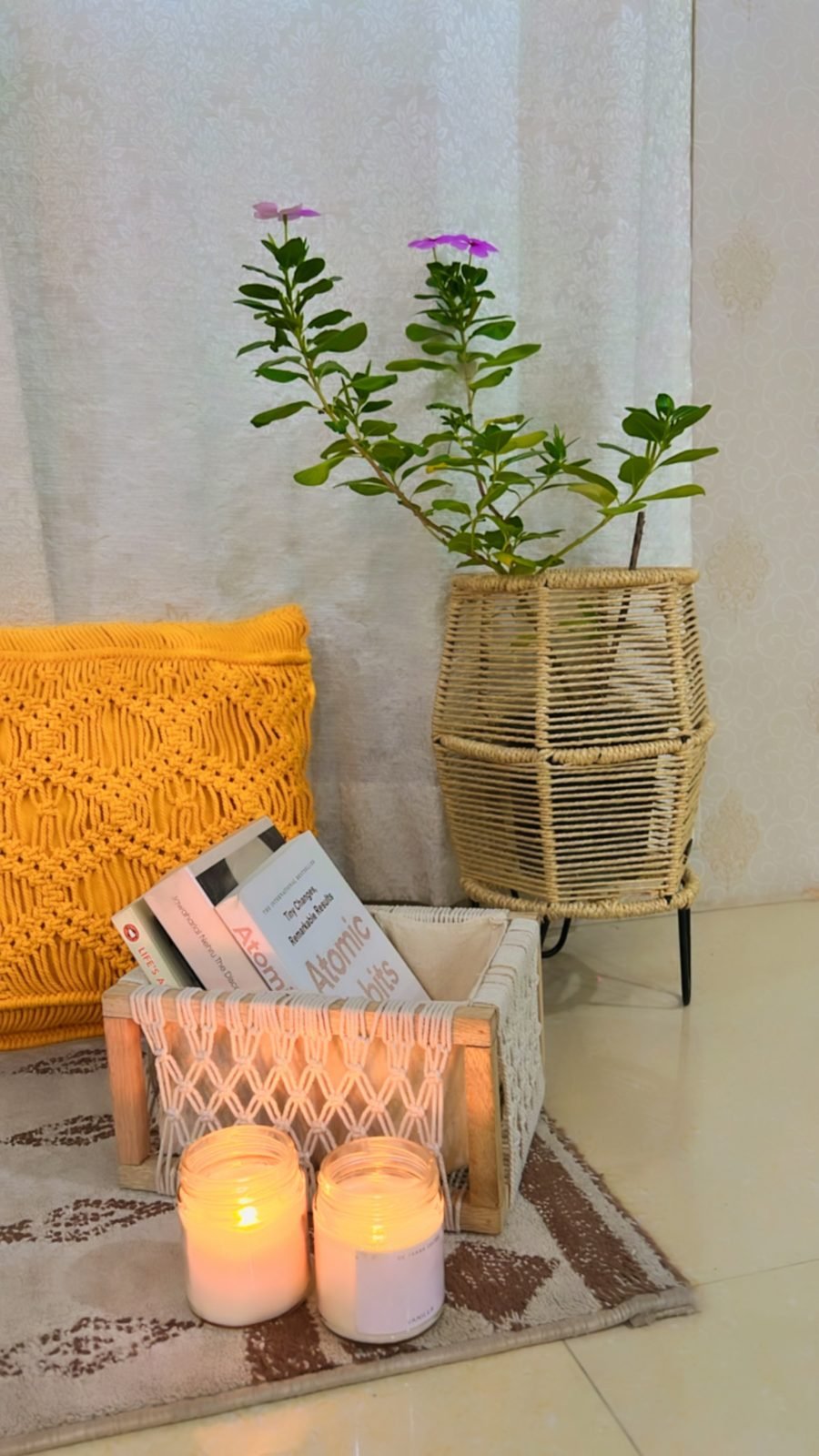 Macramé basket planter and book crate styled with candles